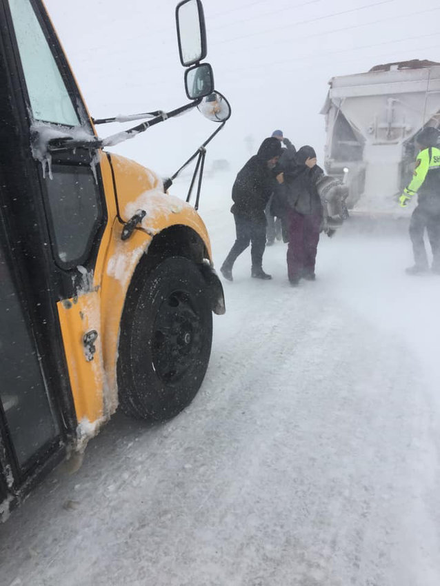 In response to treacherous travel conditions, Douglas County School District deploys school buses to rescue stranded motorists along I-25, among other highways. By 7 p.m. March 13, the buses had rescued and transported more than 100 people.